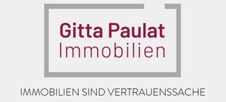Logo von Gitta Paulat Immobilien mit dem Slogan &bdquo;Immobilien sind Vertrauenssache&ldquo; in roter Schrift.